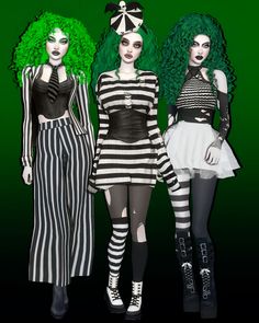 three women dressed in black and white striped outfits, one with green hair the other wearing red