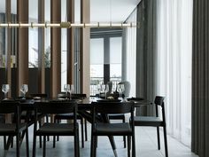 a dining room table with chairs and wine glasses on it