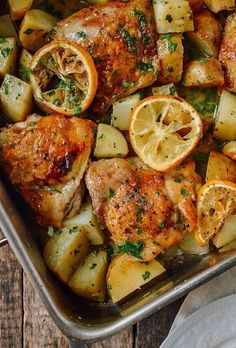 chicken, potatoes and lemons in a pan