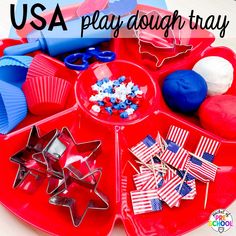 a red tray filled with patriotic items and the words usa play dough tray