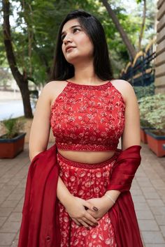 Red attached cancan lehenga with all over floral print. Paired with a padded blouse with placed hand embroidery and dupatta with mirror work hand embroidery. - Aza Fashions Red Gown For Reception Diwali Season, Red Gown For Reception Diwali Festival, Red Gown For Reception During Diwali, Red Gown For Reception And Diwali, Red Georgette Lehenga With Unstitched Blouse, Red Floor-length Lehenga With Unstitched Blouse, Sleeveless Choli For Wedding And Diwali, Red Floor-length Sets For Reception, Traditional Sleeveless Festive Gown