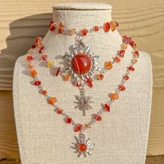 "Silver Wire Wrapped Carnelian Crystal Choker/Gemstone Necklace/Carnelian Crystal Hippie Necklace/Boho Crystal Choker/Sun Charm Necklace/Gift - Choker style crystal necklace with Carnelian Chip Crystal Beads, one of 3 charms available - Length is 15\", 16\", 17\", 18\" or 19\"  - Materials: Silver plated copper wire, natural Carnelian crystals and, brass and stone charms Check other styles in my shop: https://www.etsy.com/listing/1442563528/green-aventurine-wire-wrapped-gold?click_key=4cabd23364 Dragon Fire, Opalite Crystal, Sun Charm, Boho Crystal, Carnelian Crystal, Wire Wrapping Crystals, Purple Agate, Hippie Necklace, Rose Quartz Necklace