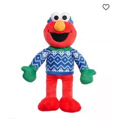 the sesame character is wearing an ugly sweater