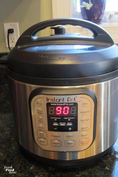 an instant pot on a counter top with the timer turned to 11 o'clock