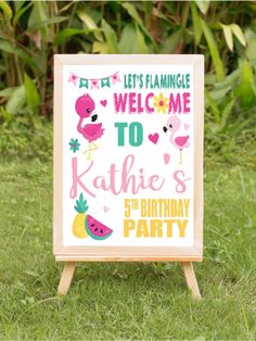 a welcome sign with flamingos and watermelon on it