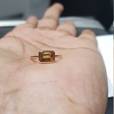 14k solid rose gold natural AAA quality emerald cut rectangular shaped citrine semi precious gemstone ring. 1. The weight of the natural citrine gemstone used in the ring =1.10 cts. 2. The weight of 14k solid rose gold used in the ring =1.130 grms. 3. The design of the ring is very nice and beautiful. 4. I have used all my skills and experience to manufacture this ring as beautiful as I can and I do hope my work will be appreciated. Thanks Faceted Emerald Cut Topaz Fine Jewelry Ring, Faceted Emerald Cut Topaz Ring In Fine Jewelry, Emerald Cut Faceted Topaz Ring In Fine Jewelry Style, Rectangular Rose Gold Jewelry With Prong Setting, Rectangular Prong Set Topaz Ring Fine Jewelry, Emerald Cut Topaz Ring In Rose Gold, Emerald-cut Topaz Ring In Rose Gold, Rose Gold Emerald Cut Topaz Ring, Emerald Cut Citrine Gemstone Jewelry