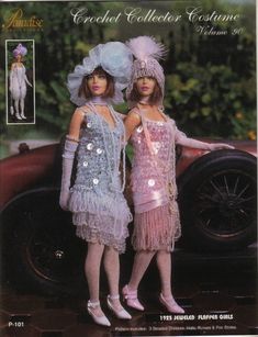 two women in dresses and hats standing next to a car