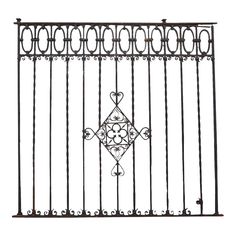 an iron gate with decorative designs on the top and bottom, isolated against a white background