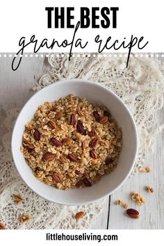 a bowl filled with granola on top of a white table