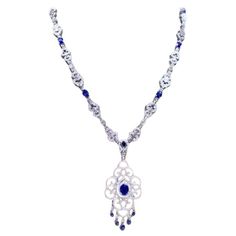 An exquisite necklace in Art Deco design, so particular and refined style, by Italian designer. Necklace come in 18K gold with 13 pieces of natural Ceylon Sapphires of 15.74 carats,in perfect cut, extra fine quality and grade, spectacular color, and 688 pieces of natural diamonds of 9,53 carats, F color VS clarity, very sparkly diamonds, top quality. Piece of high jewelry. Handcrafted by artisan goldsmith. Excellent manufacture and quality of stones. Complete with AIG certificate. Whosale price. 18k Gold Necklace, Designer Necklace, Ceylon Sapphire, Big Diamond, Italian Designer, Art Deco Design, High Jewelry, Italian Design, Diamond Jewelry