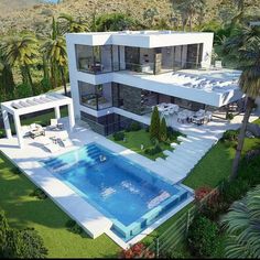 an aerial view of a house with a swimming pool