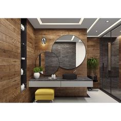 a modern bathroom with wood paneling and round mirrors