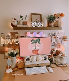 a desktop computer sitting on top of a wooden desk