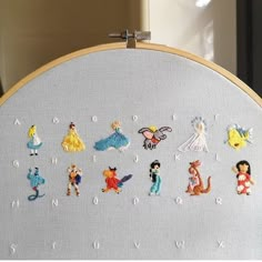 the embroidery is on and there are many disney characters