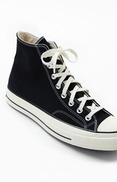 Keep things cool and classic down below with help from the Converse Black Chuck 70 High Top Shoes. These essential kicks boast a sturdy canvas upper, metal eyelets on the sides for ventilation, and a rubber outsole for added traction.

PLEASE NOTE: This shoe is offered in men's sizes; the conversion for Converse shoes is two sizes smaller for women. For example, a woman who is a size 7.5 should order a size 5.5 in men's.


	Sturdy canvas upper
	High-top shoe, lace front
	Converse logos on side a Vintage Black Cotton Sneakers, Black Cotton Vintage Sneakers, Vintage Converse High-top Canvas Shoes, Vintage High-top Converse Canvas Shoes, Black Retro Lace-up Canvas Shoes, Retro Black Lace-up Canvas Shoes, Vintage Black Sneakers With Speckled Midsole, Converse Mid-top Canvas Shoes With Rubber Sole, Converse High-top Sneakers For Skateboarding