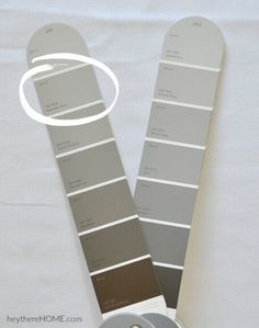 the paint swatches are arranged on top of each other in shades of gray and white