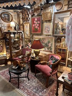 a room filled with furniture and pictures on the wall