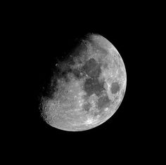 the full moon is seen in black and white