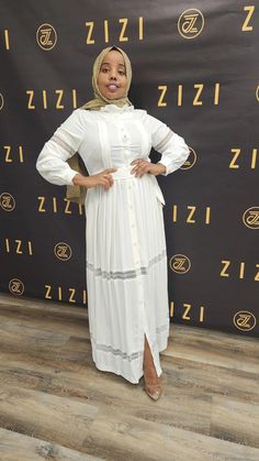 The All new Hodan Lace Dress is part of the 2023 Summer /Eid Collection. A super elegant and feminine maxi dress with lace on sleeves and bottom gives this dress more dimensions to be worn for many occasions such as school, going out, casual, and party wear with complete modesty. The dress features a fabric belt to adjust to your size and the flexibility to wear in many ways. It’s made with quality fabric making it comfortable, smooth and soft. Chiffon/Print Hijabs matched with the dresses are N Flowy Maxi Dress With Lace Patchwork, White Lace Trim Maxi Dress For Casual Wear, White Elegant Maxi Dress With Lace Trim, Elegant White Maxi Dress With Lace Sleeves, White Maxi Dress With Lace Trim, Spring Floor-length Maxi Dress With Lace Sleeves, Feminine Maxi Dress With Lace Sleeves, Flowy Long Maxi Dress With Lace Trim, Spring Maxi Dress With Lace Sleeves And Floor-length