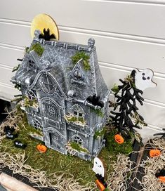 a halloween house with pumpkins and ghost decorations