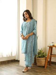 Beautiful handcrafted straight kurta pants set in pure cotton with lovely matching cotton doriya dupatta that is rightly finished with small floral embroidery motifs. Color: Blue Fabric: Kurta & Bottom - Cotton Dupatta -Kota Doria Note: Length and sizes can be customised Length - Kurta 40 inches Pants 38 inches Available in other colors If you happen to see some deformity in hand-work or fabric, that’s mere the technique of the same and not a defect. The garment is quite premium. The product wil Cotton Palazzo Set With Resham Embroidery For Diwali, Semi-stitched Cotton Blue Palazzo Set, Designer Cotton Sharara With Straight Kurta, Blue Semi-stitched Cotton Palazzo Set, Designer Cotton Palazzo Set With Dabka Work, Cotton Kurta With Chikankari Embroidery In Traditional Drape, Blue Cotton Palazzo Set With Traditional Drape, Cotton Kurta With Chikankari Embroidery, Cotton Salwar Kameez With Resham Embroidery