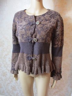 Fabulous chocolate brown velour knitted cardigan.  This is light and dark brown with long sleeves that flare at the cuff.  It has a pattern and a dark brown band on the waist and arms,  the hem has a frill and it closes with  3 large buttons.  Good condition. Bust flat;  20" Inside sleeve;  18" Length;  22" Made by GANTEBS Brown Buttoned Sweater Coat For Winter, Brown Winter Sweater Coat With Buttons, Brown Buttoned Sweater For Winter, Vintage Knitted Sweater Coat For Fall, Brown Buttoned Sweater Coat For Fall, Brown Sweater Coat With Buttons For Fall, Vintage Knit Sweater Coat For Fall, Fitted Brown Cardigan For Fall, Brown Knit Sweater With Buttons