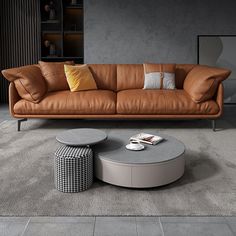 a living room with a couch, table and bookshelf in the back ground