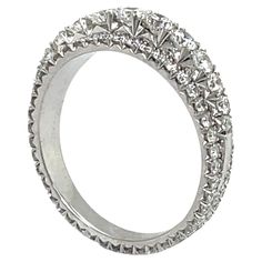 a white gold ring with rows of diamonds