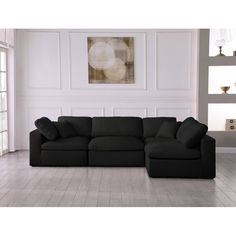 a black sectional sofa in a white room