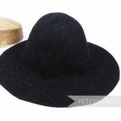 This wool felt capeline hat body is made from 100% thick Australian wool and has been stiffened to help in the hat blocking process. Even better, it has been dashed with ivory hare fur strands to make for a luxurious confetti effect. Great for making fascinators and hats from scratch the traditional way. Capeline Measures approx.: 2.5-3mm thick Flat measurement 28x46cm (11x18.1 inches) Weight: 120g Brim width from side crown to brim edge: 8-10cm (3.1-3.9 inches) Stiffener: 1 degree shellac stiff Wool Wide Brim Cloche Hat, Winter Felt Hat With Curved Brim, Wide Brim Wool Cloche Hat, Wide Brim Felt Hat For Winter, Winter Brimmed Felt Hat, Winter Wool Hat With Curved Brim, Winter Wool Top Hat With Flat Brim, Wide Brim Wool Hat For Winter, Solid Wool Felt Hat For Winter