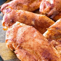 some chicken is sitting on a plate and ready to be cooked in the oven for dinner