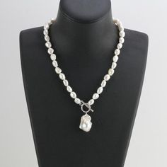 ******ON SALE******The necklace is made of 8mm white color freshwater nugget pearls and 13-15mm white baroque pearlItem No: NK604Material: freshwater pearlsShape:nugget shape and baroque pearlSize: 8mm and 13-15mmColor: whiteLuster: goodSkin: with flawsQuality: AAclasp :silver 925 with white gold plated or yellow gold platedHand Knotted: YesNecklace length: any length can make,Packing: beautiful gift pouch,ready for gift givingPlease contact Lisha freely if you have any specific demand or need c White Baroque Pearl Lariat Necklace, White Pearl Necklace With Toggle Clasp, White Toggle Necklace With Pearl Pendant As Gift, White Pearl Toggle Necklace With Pearl Charm, White Pearl Toggle Necklace With Pearl Pendant, Toggle Clasp Necklace, Pearl Lariat Necklace, Pearl Lariat, Toggle Necklace