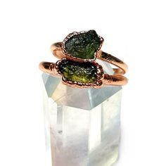 Raw green moldavite electroformed ring. The ring will be custom made in your size and will take 2 weeks to create prior to shipping. It will be sealed to preserve the finish. Stones vary in shape and color, but will be similar to the photos. Note: The moldavite is raw and unpolished, which means it may have imperfections. This ring will be created through a process called electroforming, which allows copper to build up over several hours. It is unpredictable and results in one of a kind and uniq Dr Accessories, Moldavite Ring, Electroformed Ring, Moldavite Jewelry, Druzy Ring, Drake, Unique Pieces, Custom Made, Bubbles