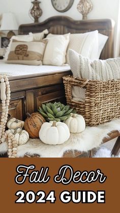 a bed with white pumpkins and other decorations on top of it, next to a wicker basket that says fall decor