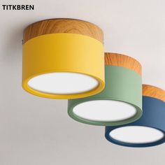 three different colored lights hanging from the ceiling