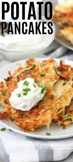 potato pancakes with sour cream on top