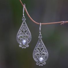 Shining tendrils form an intricate filigree lace. Crafted by hand these exquisite earrings from Komang Wijayana feature the glow of cultured pearls. White Intricate Design Drop Earrings, White Intricate Dangle Jewelry, Ornate Teardrop Jewelry With Intricate Design, White Intricate Design Dangle Earrings, Ornate White Filigree Earrings, White Bohemian Earrings With Intricate Design, White Teardrop Earrings With Intricate Design, White Filigree Dangle Jewelry, Silver Pearl Drop Earrings With Intricate Design