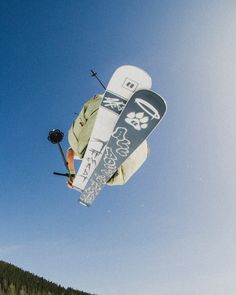 a man flying through the air while riding skis