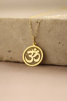 Gold Om Pendant - Yoga Gold Necklace ● Material of pendant: Solid Gold 14k ( REAL GOLD ) ● Metal Stamp: 14k ( REAL GOLD ) ● The pendant is available in 5 sizes: - 12,7 mm / 0.5 inches (Diameter) - 14,0 mm / 0,55 inches ( Diameter ) In the photos - 15,3 mm / 0.6 inches ( Diameter ) - 16,5 mm / 0,65 inches ( Diameter ) - 19,1 mm / 0,75 inches ( Diameter ) ( In the photos the size is 14mm / 0.55 inches Diameter ) ( Jump Ring inner diameter: 4 mm ) ● Material of chain: Solid gold 14k ( REAL GOLD ) I Om Locket Gold For Men, Om Gold Pendant For Men, Om Pendant Gold For Women, Om Locket Gold, Om Pendant For Men, Om Locket, Gold Pendants For Men, Yoga Pendant, Om Necklace