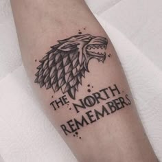 a game of thrones tattoo with the words'the north remembers'on it