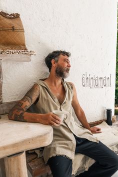 "⫸ We ship by EXPRESS EMS now for fast & safe delivery! This long sleeveless man shirt with a huge hood is a very bohemian, yet classy piece from our raw cotton collection. It is made out of 100% raw cotton - very light, soft, breathable fabric, that looks gorgeously natural. In this shirt the beauty of raw fabric is manifested through original design. Hemline is open, front and back are asymmetrically decorated with long handmade rips; soft huge hood creates very cozy feeling. We make this Bohemian Hooded Top For Summer, Burning Man Boots, Fashion Tank Tops, Male Streetwear, Boho Vest, Raw Fabric, Burning Man Outfits, Hoodie Cardigan, Hooded Vest