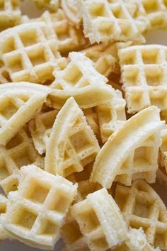 some waffles are on a white plate and ready to be eaten