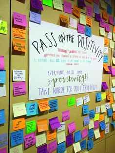 a bulletin board covered in sticky notes and post - it notes that read pass on the positiveness