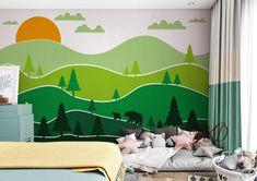 a bedroom decorated in pastel colors with trees and mountains painted on the wall