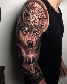 a man with a wolf tattoo on his arm