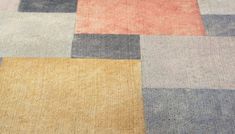 an area rug with different colored squares on it