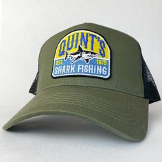 Quint's Shark Fishing - vintage style retro trucker cap - brand new. Condition is New with tags.  This is the olive version, please see other listings for the navy and the white version. The cap is wrapped in tissue paper and shipped in a rigid box so it'll arrive in perfect condition. Brilliant exclusive design, not available anywhere else. Great conversation starter and gift for fans of Jaws. Retro Curved Bill Trucker Hat For Baseball Season, Summer Fishing Trucker Hat, Green Trucker Hat With Logo Patch, Casual Snapback Trucker Hat For Fishing, Fishing Trucker Cap With Curved Bill, Trucker Baseball Cap For Fishing With Curved Bill, Trucker Baseball Cap With Curved Bill For Fishing, Trucker Baseball Cap With Curved Brim For Fishing, Vintage Trucker Hat With Curved Bill For Outdoor