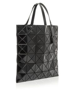 With its edgy, geometric design, Issey Miyake's cult-favorite design turns heads..Double adjustable handles.Open top; lined.Interior zip pocket.13.5'W x 0.25'D x 13.5'H; 6' handle drop.Mannequin model measurements: 5'10' height.PVC/polyester/nylon/polyurethane/brass.Imported.Web ID: 1785634 Luxury Geometric Shoulder Bag With Removable Pouch, Luxury Geometric Bag With Removable Pouch, Luxury Geometric Shoulder Bag For Everyday Use, Luxury Bag With Removable Geometric Pouch, Elegant Geometric Bags For Daily Use, Modern Geometric Shoulder Bag With Removable Pouch, Geometric Bags With Removable Pouch For Daily Use, Geometric Evening Bag, Modern Black Geometric Bags