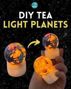 someone is holding two tea light planets in their hand with the words diy tea light planets above them