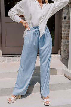 It will surely be a major fashion milestone when you add these chic sky blue pants to your wardrobe with their lightweight flowy material, high elastic waistline with a tie belt, side pockets and a single accent back pocket cut, and a slouched silhouette that falls straight into ankle-length hemlines! Measurements S : Front Rise 14.5", Hip 42", Inseam 30", Length 43", Waist 24-28". M : Front Rise 14.5", Hip 44", Inseam 30", Length 44", Waist 26-30". L : Front Rise 14.5", Hip 46", Inseam 30.5", L Non-stretch High-waisted Light Blue Pants, Light Blue High-waisted Cotton Pants, Casual High-waisted Blue Parachute Pants, Blue High-waist Parachute Pants With Pockets, Pleat Top, Impressions Online Boutique, Blue Pants, Model Fits, Hip Length